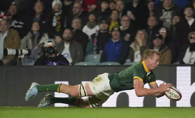 South Africa's Pieter-Steph du Toit goes over the line to score a try during the Autumn Nations series rugby union match between England and South Africa, at Twickenham, in London, Saturday, Nov. 16, 2024. (AP Photo/Kin Cheung)