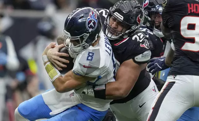 Houston Texans defensive tackle Tommy Togiai (72) sacks Tennessee Titans quarterback Will Levis (8) during the second half an NFL football game Sunday, Nov. 24, 2024, in Houston. (AP Photo/Ashley Landis)