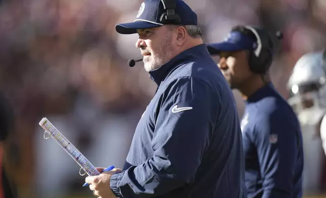 Dallas Cowboys head coach Mike McCarthy looks on during the first half of an NFL football game against the Washington Commanders, Sunday, Nov. 24, 2024, in Landover, Md. (AP Photo/Stephanie Scarbrough)