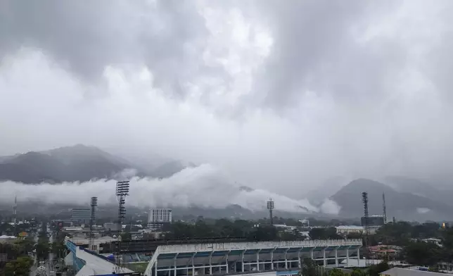 Storm clouds descend over the Francisco Morazan stadium during rains brought on by Tropical Storm Sara in San Pedro Sula, Honduras, Friday, Nov. 15, 2024. (AP Photo/Moises Castillo)
