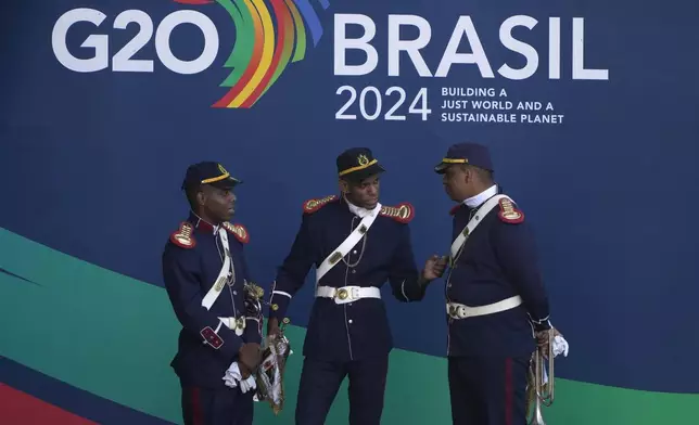 Brazilian honor guard wait for the start of a welcoming ceremony prior to the G20 Summit in Rio de Janeiro, Monday, Nov. 18, 2024. (AP Photo/Eraldo Peres)