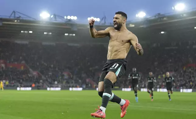 Liverpool's Mohamed Salah celebrates after scoring during the English Premier League soccer match between Southampton and Liverpool in Southampton, England, Sunday, Nov. 24, 2024. (AP Photo/Sean Ryan)