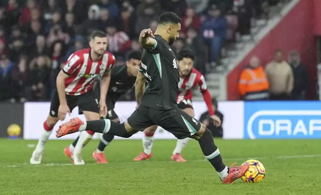 Liverpool's Mohamed Salah scores from a penalty kick during the English Premier League soccer match between Southampton and Liverpool in Southampton, England, Sunday, Nov. 24, 2024. (AP Photo/Sean Ryan)