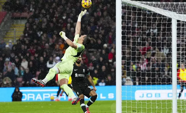 Southampton's goalkeeper Alex McCarthy saves during the English Premier League soccer match between Southampton and Liverpool in Southampton, England, Sunday, Nov. 24, 2024. (AP Photo/Sean Ryan)