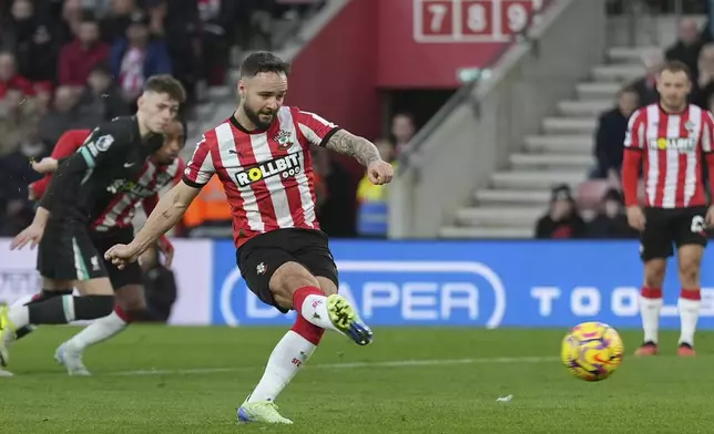 Southampton's Adam Armstrong scores from the penalty kick during the English Premier League soccer match between Southampton and Liverpool in Southampton, England, Sunday, Nov. 24, 2024. (AP Photo/Sean Ryan)