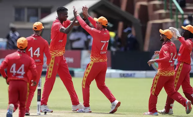 Zimbabwe cricket team celebrate a wicket during the first of the ODI cricket match between Zimbabwe and Pakistan at Queens Sports Club in Bulawayo, Zimbabwe, Sunday, Nov. 24, 2024. (AP Photo/Wonder Mashura)