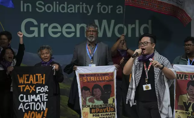 Arnold Jason Del Rosario leads a demonstration on climate finance at the COP29 U.N. Climate Summit, Monday, Nov. 18, 2024, in Baku, Azerbaijan. (AP Photo/Peter Dejong)