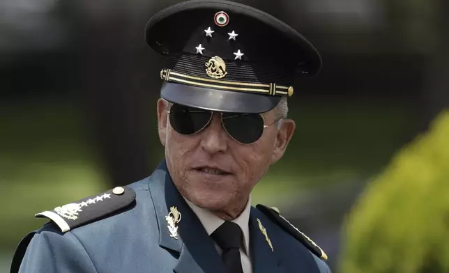 FILE - Secretary of Defense Salvador Cienfuegos arrives for a review of the troops that will participate in the Independence Day parade, in Mexico City, Sept. 14, 2016. (AP Photo/Rebecca Blackwell, File)