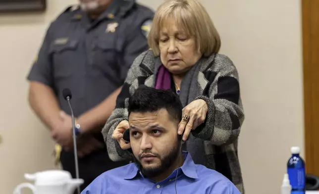 FILE - A translator assists Venezuelan Jose Ibarra with headphones during his murder trial at the Athens-Clarke County Superior Court, in Athens, Ga., Nov. 19, 2024. (Arvin Temkar/Atlanta Journal-Constitution via AP File)