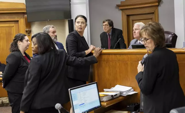 FILE - Prosecutors and defense attorneys meet with Judge H. Patrick Haggard during the murder trial of Venezuelan Jose Ibarra, at the Athens-Clarke County Superior Court, in Athens, Ga., Nov. 19, 2024. (Arvin Temkar/Atlanta Journal-Constitution via AP File)