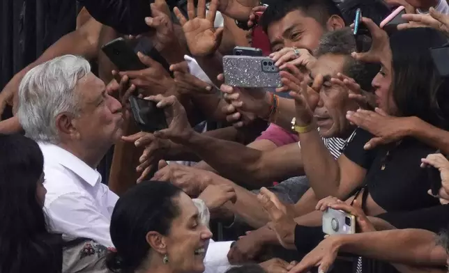 FILE - Mexican President Andrés Manuel López Obrador greets supporters as he arrives at the capital's main square, the Zócalo, in Mexico City, Nov. 27, 2022. (AP Photo/Marco Ugarte, File)