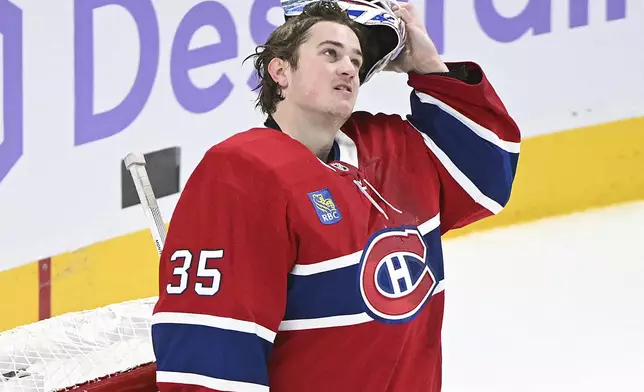 Montreal Canadiens goaltender Sam Montembeault looks on after being scored on for the fifth time by the Vegas Golden Knights during second period NHL hockey action in Montreal, Saturday, Nov. 23, 2024. (Graham Hughes/The Canadian Press via AP)