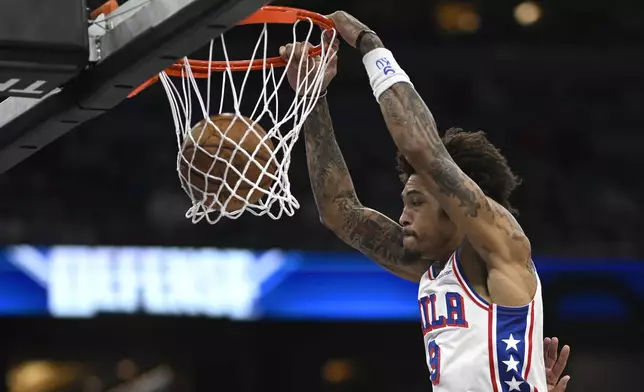 Philadelphia 76ers guard Kelly Oubre Jr. (9) dunks against the Orlando Magic during the first half of an Emirates NBA Cup basketball game, Friday, Nov. 15, 2024, in Orlando, Fla. (AP Photo/Phelan M. Ebenhack)