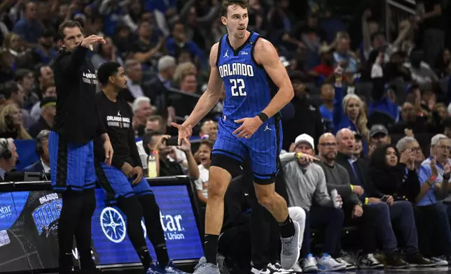 Orlando Magic forward Franz Wagner (22) celebrates his three-point shot during the first half of an Emirates NBA Cup basketball game against the Philadelphia 76ers, Friday, Nov. 15, 2024, in Orlando, Fla. (AP Photo/Phelan M. Ebenhack)