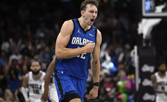 Orlando Magic forward Franz Wagner (22) celebrates after scoring during the second half of an Emirates NBA Cup basketball game against the Philadelphia 76ers, Friday, Nov. 15, 2024, in Orlando, Fla. (AP Photo/Phelan M. Ebenhack)