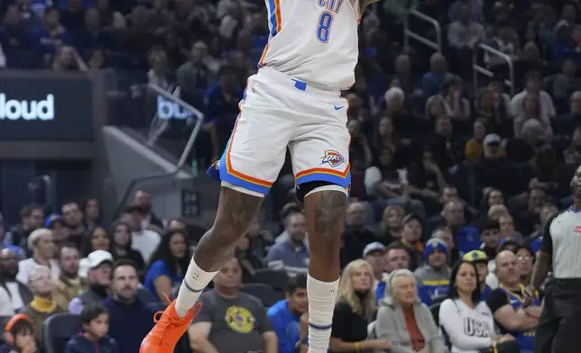 Oklahoma City Thunder forward Jalen Williams (8) shoots in front of Golden State Warriors forward Lindy Waters III during the first half of an NBA basketball game Wednesday, Nov. 27, 2024, in San Francisco. (AP Photo/Godofredo A. Vásquez)