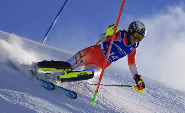 Switzerland's Wendy Holdener speeds down the course during an alpine ski, women's World Cup slalom, in Gurgl, Austria, Saturday, Nov. 23, 2024. (AP Photo/Giovanni Maria Pizzato)