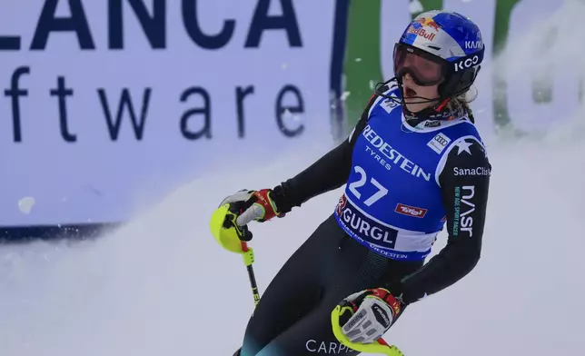 Albania's Lara Colturi celebrates at the finish area of an alpine ski, women's World Cup slalom, in Gurgl, Austria, Saturday, Nov. 23, 2024. (AP Photo/Giovanni Maria Pizzato)