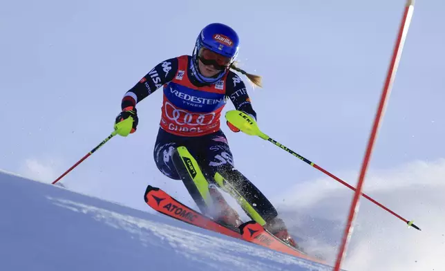 United States' Mikaela Shiffrin speeds down the course during an alpine ski, women's World Cup slalom, in Gurgl, Austria, Saturday, Nov. 23, 2024. (AP Photo/Giovanni Maria Pizzato)