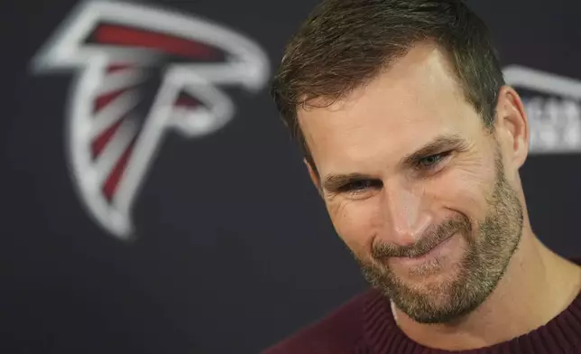 Atlanta Falcons quarterback Kirk Cousins considers a question during a news conference after an NFL football game against the Denver Broncos, Sunday, Nov. 17, 2024, in Denver. (AP Photo/David Zalubowski)