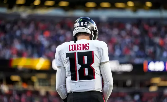 Atlanta Falcons quarterback Kirk Cousins (18) prepares for a play against the Denver Broncos during the second half of an NFL football game, Sunday, Nov. 17, 2024, in Denver. (AP Photo/Jack Dempsey)