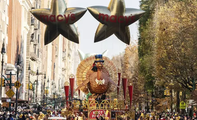 FILE - The Tom Turkey float leads the way down Central Park West during the Macy's Thanksgiving Day Parade on Nov. 24, 2022, in New York. (AP Photo/Jeenah Moon, File)