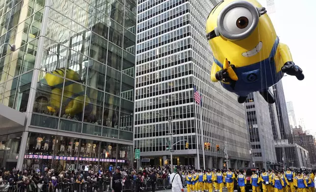 FILE - The Stuart the Minion balloon floats appears during the Macy's Thanksgiving Day Parade on Nov. 24, 2022, in New York. (Photo by Charles Sykes/Invision/AP, File)