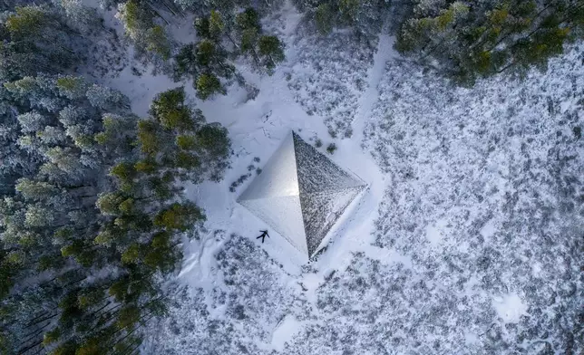 The Prince Albert Cairn, built in 1862 by Queen Victoria, is surrounded by snow and ice, near Balmoral, Aberdeenshire, Scotland, Friday Nov. 22, 2024. (Jane Barlow/PA via AP)