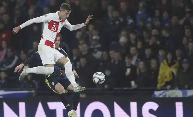 Croatia's Luka Sucic kicks the ball during the UEFA Nations League soccer match between Scotland and Croatia at Hampden Park in Glasgow, Scotland, Friday, Nov. 15, 2024. (AP Photo/Scott Heppell)