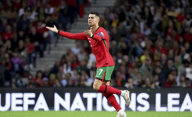 Portugal's Cristiano Ronaldo gestures during the UEFA Nations League soccer match between Portugal and Poland at the Dragao stadium in Porto, Portugal, Friday, Nov. 15, 2024. (AP Photo/Luis Vieira)