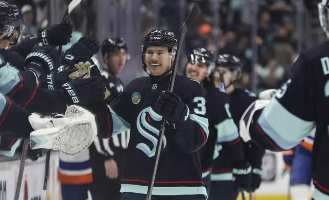 Seattle Kraken center Yanni Gourde (37) celebrates after scoring against the New York Islanders during the first period of an NHL hockey game, Saturday, Nov. 16, 2024, in Seattle. (AP Photo/Rio Giancarlo)