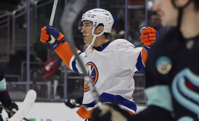 New York Islanders left wing Pierre Engvall reacts after scoring against the Seattle Kraken during the first period of an NHL hockey game, Saturday, Nov. 16, 2024, in Seattle. (AP Photo/Rio Giancarlo)