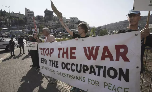 Israelis and Palestinian citizens of Israel protest Israel's military operations in the Gaza Strip, in Umm al-Fahm, Israel, Friday, Nov. 15, 2024. (AP Photo/Mahmoud Illean)