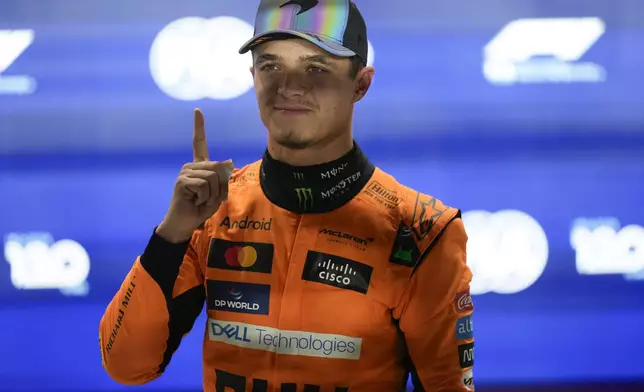 McLaren driver Lando Norris of Britain reacts after winning the pole position during sprint qualifying at the Lusail International Circuit in Lusail, Qatar, ahead of the Qatar Formula One Grand Prix, Friday, Nov. 29, 2024. (AP Photo/Darko Bandic, Pool)