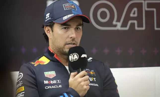 Red Bull driver Sergio Perez of Mexico attends a news conference at the Lusail International Circuit in Lusail, Qatar, ahead of the Qatar Grand Prix, Thursday, Nov. 28, 2024. (AP Photo/Darko Bandic)