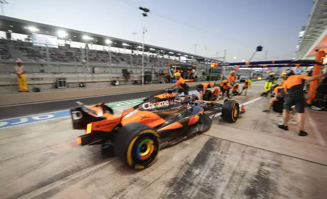 McLaren driver Oscar Piastri of Australia enters the pit during practice at the Lusail International Circuit in Lusail, Qatar, ahead of the Qatar Formula One Grand Prix, Friday, Nov. 29, 2024. (AP Photo/Darko Bandic)