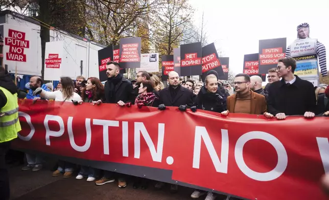 Yulia Navalnaya, third from right, leads with Russian opposition politics Vladimir Kara-Murza, center, and Ilya Yashin, second from right, a demonstration under the slogan "Stop Putin! Stop the War! Freedom for Political Prisoners!" in Berlin, Germany, Sunday, Nov. 17, 2024. (AP Photo/Markus Schreiber)