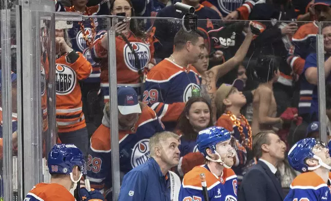 Edmonton Oilers' Connor McDavid (97) celebrates his 1000th point, against the Nashville Predators during the second period of an NHL hockey game, Thursday, Nov. 14, 2024 in Edmonton, Alberta. (Jason Franson/The Canadian Press via AP)