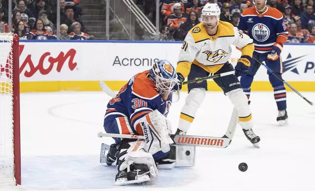 Nashville Predators' Steven Stamkos (91) is stopped by Edmonton Oilers goalie Calvin Pickard (30) during the first period of an NHL hockey game, Thursday, Nov. 14, 2024 in Edmonton, Alberta. (Jason Franson/The Canadian Press via AP)