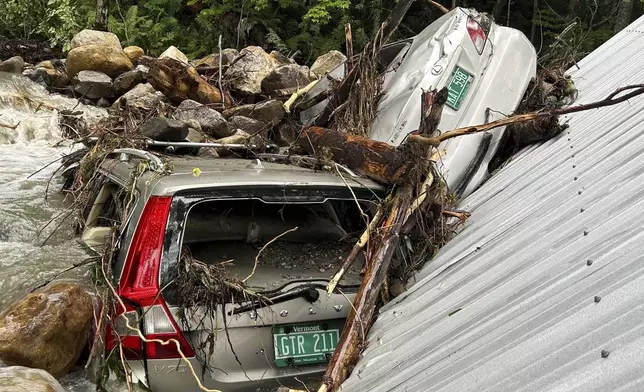 The Mackenzie family's flood-ravaged cars are shown on July 12, 2024, in Peacham, Vt., after severe flooding destroyed their home and vehicles. (Courtesy of Cornelia Hasenfuss via AP)