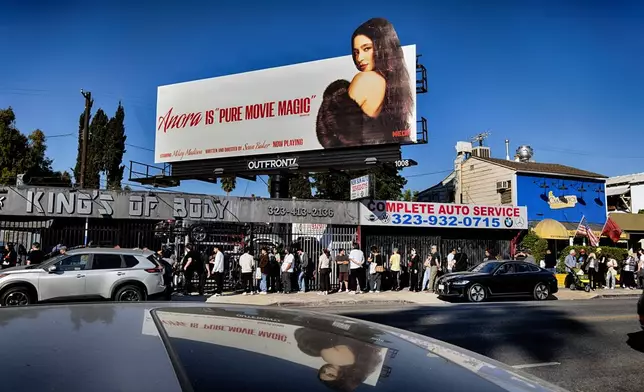 Anora movie fans stretch down Melrose Blvd. to line up for a Pop-Up event for the movie Anora on Saturday, Nov. 9, 2024 in Los Angeles. (AP Photo/Richard Vogel)