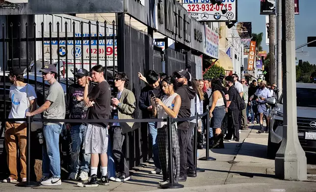 Anora movie fans line up at a merchandise Pop-Up event for recently released film Anora on Saturday, Nov. 9, 2024 in Los Angeles. (AP Photo/Richard Vogel)