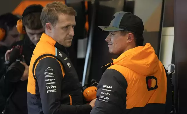 McLaren driver Lando Norris, of Britain, talks with his crew after the final practice session for the Formula One U.S. Grand Prix auto race, Friday, Nov. 22, 2024, in Las Vegas. (AP Photo/John Locher)