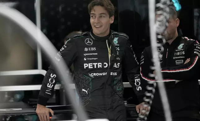 Mercedes driver George Russell, of Britain, waits in the garage area prior to a practice session for the Formula One U.S. Grand Prix auto race, Thursday, Nov. 21, 2024, in Las Vegas. (AP Photo/Matt York)