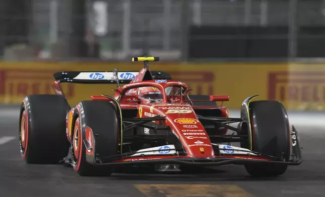 Ferrari driver Carlos Sainz, of Spain, drives during the final practice session for the Formula One U.S. Grand Prix auto race, Friday, Nov. 22, 2024, in Las Vegas. (AP Photo/Rick Scuteri)