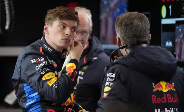 Red Bull driver Max Verstappen, of the Netherlands, talks with his crew after the final practice session for the Formula One U.S. Grand Prix auto race, Friday, Nov. 22, 2024, in Las Vegas. (AP Photo/John Locher)