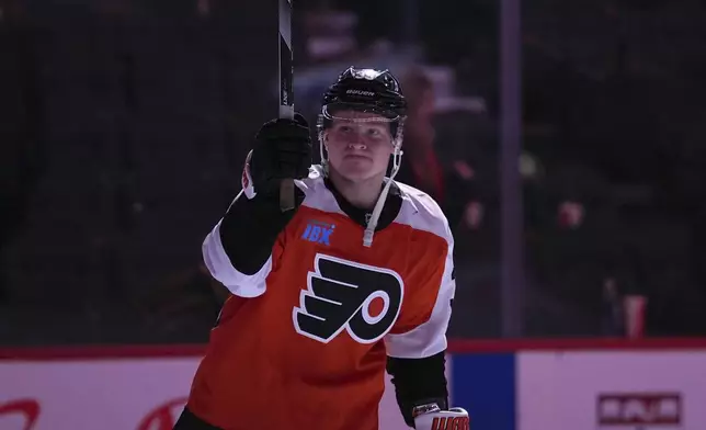 Philadelphia Flyers' Matvei Michkov reacts after scoring the game-winning goal during overtime in an NHL hockey game against the Chicago Blackhawks, Saturday, Nov. 23, 2024, in Philadelphia. (AP Photo/Matt Slocum)