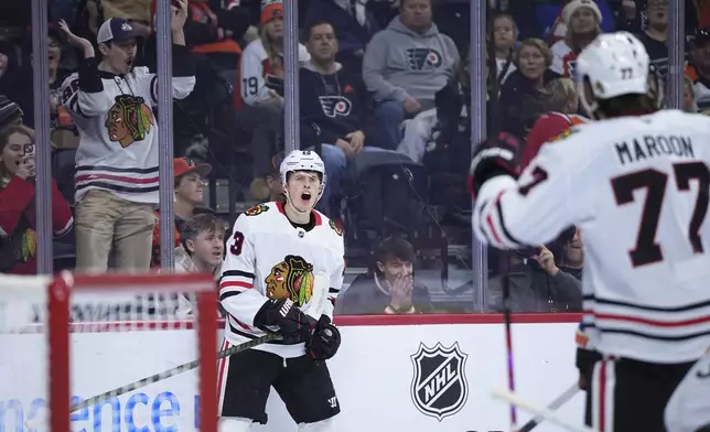 Chicago Blackhawks' Lukas Reichel reacts after scoring during the first period of an NHL hockey game against the Philadelphia Flyers, Saturday, Nov. 23, 2024, in Philadelphia. (AP Photo/Matt Slocum)