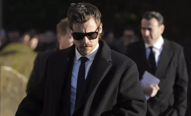 Harry Styles walks after the funeral service of One Direction singer Liam Payne at St Mary's Church in Amersham, England, Wednesday, Nov. 20, 2024. (Andrew Matthews/PA via AP)
