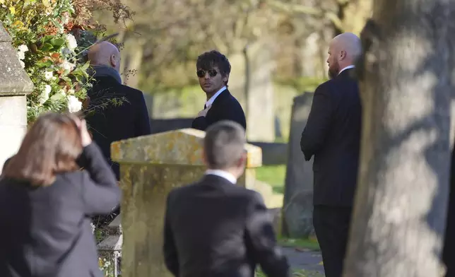 Former One Direction band member Louis Tomlinson arrives for the funeral service of One Direction singer Liam Payne at St Mary's Church in Amersham, Buckinghamshire, England, Wednesday Nov. 20, 2024. (Jonathan Brady/PA via AP)